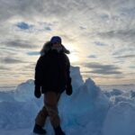 Dianna Cowern Instagram - the cold never bothered me anyway. Throwback to Feb this year in Prudhoe Bay Alaska, the “census-designated place” at the end of the Ice Road Truckers’ road. And the last photo is 160 miles north of THAT, where I slept on arctic sea ice above a nuclear submarine. With my current long covid health issues, I’m working very slowly on getting more videos about the nuclear submarine out for you guys, so stay tuned. Not too tuned…just a little tuned ☺️