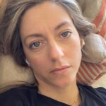 Dianna Cowern Instagram - I have 4 months worth of selfies like this because couch is all I’ve been doing. Since July, I’ve been struggling with what’s called “Long COVID.” Someone you know might’ve had this syndrome, and not even known. For me, the symptoms are, being unable to get out of bed for a few weeks after I pushed to finish my last YouTube video. (Post-Exertional Malaise). Becoming dizzy and nauseous if I walk more than 10 mins a day (Exercise Intolerance). Spelling cancel “cansul” in an email, losing my place in the sentence I was just writing, inability to process any scientific papers (Brain Fog). Getting extremely stressed while driving. (Emotional Disregulation) Along with extreme fatigue, sleeping like a teenager, breathlessness, digestive issues, chest pain, and kryptonite intolerance. Post-COVID syndrome takes a few forms, including post-ICU complications, but mine is very similar to Myalgic encephalomyelitis/chronic fatigue syndrome (ME/CFS). I’m hoping to make a video soon about this, but not yet. There won’t be a lot of videos from me for the next few months. I’m sad too. 😛
