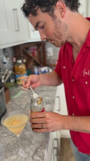 Dina Deleasa Instagram - Fun fact @kevinjonas moonlights as my bartender in the kitchen lol 

Not having olives on hand ended up being the start of something tasty. Being the resourceful people we are, we used hot cherry pepper juice leftover from a dip I recipe tested in this shaken martini! 

While I may not have an exact recipe , if your a martini lover or been loving the pepperoncini martini that’s been floating around , this is for you! Also bonus points for wearing a matching shirt while you shake it up!

*please note this for 21  , I also do not promote frequent or binge drinking in any capacity. My personal conviction is that a glass of wine or a cocktail is ok, you may feel differently*

#vacationvibes #dirtymartini #cocktailsofinstagram #familythateats #dishitgirl