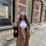 Dita Istrefi Instagram - Dump in Antwerp Casquette: @miumiu Sac: @coperni Manteau: @cosstores Pantalon: @burberry T-shirt: @zara Baskets: @prada