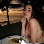 Dominique Alagia Instagram - protecting my inner peace also a photo dump of all my moods lately - beach, food and just me happily enjoying life