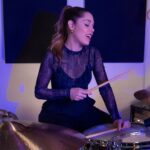 Domino Santantonio Instagram - Check out Domino as she nails a drum cover of Kenya Grace’s hit Strangers 💥 🥁 💥 How would you describe Domino’s drumming style in 3 words? Let us know in the comments. #drumcover #drums #drumming #drummer #dominosantantonio #kenyagrace #strangers #strangerscover #drummingstyle #thomann #speakmusic