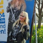 Doro Pesch Instagram - So awesome to spend some time in my former hometown Düsseldorf and see this all over the place! The "Dreckwegtag" is a campaign to keep Düsseldorf clean or to make it clean again. Everyone can take part in this. The whole thing happens next Saturday. Find out more at @dreckwegtag And keep your neighborhood clean, no matter where you are 🧹 Und speziell für die Deutschen: Könnt Ihr sehen, was ich auf dem Plakat in der Zange halte? Was man so alles im Müll findet... 😎 🤘💪❤️🙏 #Love, #Doro - Jacket: @amandaozolinsdesigns Love you, sis! Song: 'All For You' from "Conqueress - Forever Strong And Proud" Shirt: Lemmy's Bar, Blackpool - - - - #doropesch #conqueress #allweare #warlock #lemmysbarblackpool #allformetal #dreckwegtag #keepyourcountryclean #dreckwegtagdüsseldorf #keepyourcountryclean #triumphandagony #keepdüsseldorfclean #dorofürimmer #metal #heavymetal #metalhead #metalqueen #queenofmetal #keepyourcountrytidy #fürimmer #metalheads #rocknroll #blondeshavemorefun #vegan #soberlife #nuclearblastrecords @nuclearblastrecords #monstersofrock #monstersofrockradio