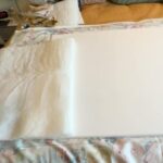 Dulcé Sloan Instagram – PART 2 of #craftingwithDulcé I am making an art piece to go over my bed. Stay tuned for Part 3.

Supplies:
3’x4’ canvas 
2 yards of fabric
5 yards of trim
@cricut brayer 
1 can spray adhesive 
1 package of cushion wrap
1 large package of thumbtacks 
2 sawtooth picture hooks
2 nails