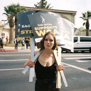 Elise Eberle Instagram - I want to clear the air here. This strike is not about millionaires asking other millionaires for more money. As of 2023, 87% of actors in the guild must have multiple side hustles or multi hyphenate themselves in order to survive. This wasn’t always the case but streaming services have changed the film industry exponentially. Actors see none of those residuals while studios see billions. All we ask is fair pay. What’s worse is the studios even ADMIT that we are in a new era yet they are fighting us tooth and nail, unwilling to take any accountability for their corporate greed or work with us in negotiating a new deal. Better think twice bc the workers aren’t going anywhere. No matter the heat. #sagaftrastrong @sagaftra