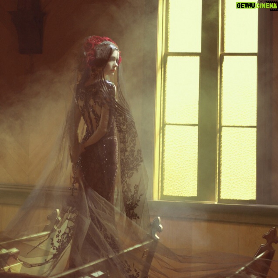 Elizabeth Tulloch Instagram - Throwback to this photo shoot with amazing photographer @franzszony. If you’re not familiar with his work, check it out! This was such a gratifying shoot, wandering around the streets of dusty Nevada, telling a different story with each photo. Gowns by @michael5inco 🖤