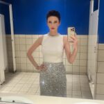 Elizabeth Tulloch Instagram – On a separate note, a) I could not resist this gorgeous Yves Klein-y blue bathroom. As I’m about to enter our final season of #SupermanandLois, in the 85th year of this incredible, powerful character existing, I wanted to pay homage to what I imagined an OG Lois from 1938 might have worn to accept an award. ❤️

Thank you to everyone involved in my look:
�Skin/Facialist: @carasoin 
Top, skirt: @aliceandolivia @staceybendet
Makeup: @andresarmiento 
Hair: @hellohairbear 
Heels: @jimmychoo
Jewelry: @gabrieleandco @michelemariepr