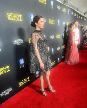 Elizabeth Tulloch Instagram - Some #behindthescenes from @saturnawards Sunday night. 
Dress: @aliceandolivia by @staceybendet 
Heels: @toryburch 
Makeup: @andremakeup 
Hair: @hellohairbear 
Skin: @theskingirls @vancouvermedicalaesthetician 
Bestie: @realbreeturner
It was such a wild night of weather!!! But incredible awards show, thank you @saturnawards!! Christopher Nolan, Keanu Reeves, Jodie Foster, James Cameron, Kevin Feige, Emily Blunt etc etc - I was fangirling everywhere. I LOVE being a part of a genre show (again - love you #Grimm fans!). Best and most loyal and smartest fans ever. Thank you so much for coming out in a major storm and I apologize to everyone who I didn’t get to in the autograph line - bc of the weather I was late to the awards and was being rushed inside. 

💓💓🥰