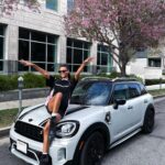 Ella Balinska Instagram - 10 years of being a proud @miniusa owner, and although the model may have changed over time, I can confirm it still drives like a go kart 😈 swipe for a throw back of the day I picked up my first car with my mum in 2014… 🥹
