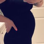 Elle Fowler Instagram - 20 week bump shot! I've been living in these simple black maternity camis. What was your go to maternity style?