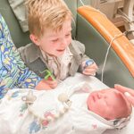 Elle Fowler Instagram – James meeting baby brother for the first time 🥰 James got to go to Chuck E Cheese for the first time while mama was in her surgery and is holding his prizes in his hands 😂