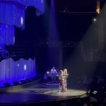 Ellie Holcomb Instagram - y’all!!! It has been an absolute JOY to be opening for @laurendaigle on her Kaleidoscope Tour. Lauren is a kindred spirit and dear friend, so to get to go on the road together feels like a dream. I’ve loved singing with people all over the place, and hearing y’all sing along. I’ve LOVED watching Lauren and her incredible band put on an amazing show in each city, each one special and unique. We are having a blast with her band and crew and my band and crew is incredble too! This week, i’ve had my daughter out on the road with me. She loves Lauren and her music, so we’ve been singing along each night together. She is also out on the road to help watch her godbrother, Triumph. His momma, of @thenewrespects, is out playing guitar for me on these shows, and it has been the sweetest thing to watch her love and help take care of him. It feels like family out here on the road, and I’m so grateful. Thanks to Lauren and her crew for making us feel so welcome, and thanks to my crew for working so hard to make it possible to play these shows and connect with so many people each night. @s.grantparker @zandymowry @jschrodt @jacthompsonmusic @morganrcombs @sethtalley @jaymindesai @shamilt0n Y’all are some of my favorite people to be with, and I feel lucky to work with so many people that I respect and love so deeply. If you’re new here to my page, welcome. It’s one big happy family here on this page. Welcome to the family!