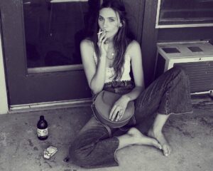 Emily Hall Instagram - This got taken down SO here’s me attempting to live out my Penny Lane dream 2.0 ✌🏻*cig is still a prop :)*