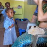 Emily Alexandra Guglielmo Instagram - Can’t walk! I’m a mermaid 🧜‍♀️ Worth it to see the children’s smiles and hear their laughter 🥹 during the @supportingwater 💧 mission in Mombasa, Kenya. #cleanwaterforall #bringjoy