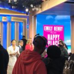 Emily Henry Instagram - Spent the morning pretending I was Jennifer Aniston on the morning show. Got to hang out with the world’s best and frankly most beautiful (NOT THAT IT MATTERS) publicists @dachejordan and @daniellekeir_. When we found out @judyblume4real was in the building we all gasped and teared up. Also got to meet @lara.spencer and @madisonbeer, and see @yarashahidi from a mere three feet away, and I would have to describe all of them as almost troublingly beautiful irl!! Swipe to the end to see the rejected look from 5:30 AM. Fewer than 24 hours until HAPPY PLACE hits shelves.