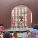 Emily Henry Instagram - Thank you all so much for coming out last night to Busch Stadium for the pre-game book club. This was one of the most special days for me of the last five years. There are no words for what it was like to get to meet so many of you. Thank you for driving and flying from all over, and for beautiful friendship bracelets, and for your letters and pencils, and for wearing your rodeo and Goode Books and Sunshine Falls Gear. It was a joy and an honor to sweat on you. A huge thank you to the Cardinals for the invitation, @juliepens for being the perfect in-conversation partner, @abergeron11 @dachejordan @daniellekeir_ and @tayhaggerty for being there for every moment of it!! I did not face my greatest fear (throwing an opening pitch) but I did face my second greatest fear (high-fiving a mascot), and that’s not nothing. 💙💙💙💙💙💜💜💜💜💜