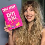 Emily Henry Instagram - One week until release and I’m freaking out honestly. Trying to channel my jitters directly into my hair. Wonder if by styling myself exactly as I did at 17 I’m helping manifest speak now (tv). Still some signed copies of happy place available for preorder via books a million.