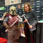Emily Swallow Instagram - Is there a better place to be on Star Wars Day than at a fan convention? The joy was absolutely electric. However, we all know that, no matter how boisterous and confident we may seem on the outside, there could be shadows lurking beneath the surface that no one knows but we ourselves. On #thisisthewaywednesday, I want to tell you about a group of fans I met who walk The Way in a real, practical, uplifting way that was truly a day-to-day endeavor. They’d been talking online for a year, and this convention was their first in-person meeting. Between them, they knew they were dealing with severe social anxiety, a seizure disorder and other physical and emotional difficulties that might very well keep many people home in isolation. But they also had something else in common: a desire to trust each other, to practice vulnerability and to support each other. I saw them multiple times through the weekend in various states of joy and exhaustion, and I heard how they navigated tricky moments including panic attacks. At the end of the convention, they were tired and ready for rest, but they were SO joyful that they’d had the experience and stuck with each other (and with themselves) through it all. I am continually inspired by the way all of you lift each other up even with a strength you didn’t know you had. When we are acting in service to someone we love, we realize we could probably stand to show ourselves that same love, gentleness and courage. This is the Way. P.S. I lost track of which of my fabulous Armorers was which, so please forgive me if I’ve mistagged you or didn’t know your handle! Tag yourselves please! #mentalhealthawareness #thisistheway #community #comiccon #anxiety #loveoneanother #thearmorer #alwayskeepfighting