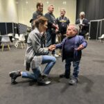 Emily Swallow Instagram - #Throwback to a year ago when I had so much fun at @starwarscelebration that I lost my voice! That didn’t stop me from strutting down the runway with the @belgian_prop_crew, fawning over @warwickadavis, kickin’ it with @krystinaarielle and trying to keep @thegiancarloesposito and @carlweathers from stealing all the shots. We even celebrated @therealkateesackhoff’s bday with a cake of…well, her. The best part was having @breewelchandhenry with me the whole weekend! Let’s do it again in Japan, shall we? #armorerapproved #thisistheway #tbt #throwbackthursday #london #starwarscelebration #themandalorian #glam