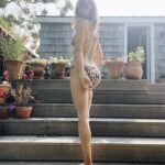 Emily Wickersham Instagram - The story of me and a @shopdoen bikini Girl in bathing suit: sits, stands, looks, stands, dances, twirls, sits, ties, rests, pretends to be done with a big day of surfing tiny waves, etc. The end.