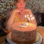 Emma Myles Instagram – You know, I was seeing everyone’s years in review and I was like, I feel like I did nothing. But then I was like, wait a lot of things happened this year. We had 2 🪧’s, I turned 40, I was blessed by Tori Amos, I got my first tattoo, I went back to my homeland, and I basically wrote 2 books. It’s hard when things are happening in a vacuum. It feels like time is just moving and here you are, standing still, the same. But I’m not the same. I am older. My brain has worked harder than it ever has. And I’m coming up on 3 years eating disorder recovery which is enough in and of itself. I don’t have a new year new me goal. I don’t need to be new. And neither do you. I just want to fill my life with happiness and gratitude and art and people I love. I just hope I don’t cut my bangs too short like I did 20 minutes before Valentine’s Day dinner last February. It took way too long to grow them back to normal. To all of my friends who understood that I just couldn’t, to my husband who pulled me up when the quicksand was swallowing me, to my cat who will always be my soulmate, to food, to the miracle of the human body and the resilience of the human mind, to a year that really and truly happened… I am grateful. Happy new year.