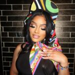 Erica Pinkett Instagram - The head never the tail👑❤️ 📸: @king.artez MUA: @ohkeliyah Hair: @lady.shondraa Hat/scarf: @emiliopucci One piece: @normakamali Belt bag: @chanelofficial