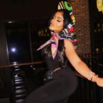 Erica Pinkett Instagram - The head never the tail👑❤️ 📸: @king.artez MUA: @ohkeliyah Hair: @lady.shondraa Hat/scarf: @emiliopucci One piece: @normakamali Belt bag: @chanelofficial