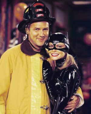 Faith Ford Instagram - This is a still from one of the episodes of “Norm”. It captures Norm’s boyish spirit perfectly. Btw the “catsuit” was not my idea! Lol! I became part of Norm’s cast  in the last two seasons. To work with Norm, you had to be on your game. He fed off the live audience like no one I had ever worked with before! When shooting a scene, if he felt the audience wasn’t along for the ride, he would get this glint in his eye & flash this little grin and you knew you better be ready! You see, I was from the written word school of sitcoms & even though Norm was an experienced comedy writer, his improvisational skills were let’s just say, effortlessly on point! I suspect he knew I was an improv novice, so just for fun, he would sometimes throw a little dialogue change up my way. Not too much of a change, just a little zinger that was not only hilarious, but also impossible to respond to with my original scripted dialogue. I would stare at him for a beat & then do my best to respond back, but ultimately ended up LMAO! I remember Norm turning out to the audience & saying “You see she wasn’t listening!”I turned out to them & said, “No! I was listening! He just changed his dialogue!”The audience would roar & for the rest of the night, they’d be completely engaged. They loved it! As time went on, I learned to be prepared for Norm’s off the cuff spontaneity. I actually grew to expect it. I eventually even enjoyed it! Looking back, what had seemed like a challenge at the time, has ultimately turned out to be a treasured memory. Thank you Norm, for one of the most formative comedy experiences of my career. You made me laugh… ♥️ #normmacdonald #gonetoosoon