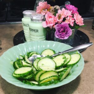 Faith Ford Instagram - Mama Pat’s pretty pink & lavender roses & crisp cucumber salad in Grandma Cora’s Jadeite serving bowl. Oh the goodness of spring!💕💚💗🥒💜
