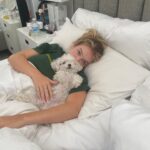 Faith Schroder Instagram - Definitely never wake up like this… Usually I’m wearing X-Large boxers and a mens shirt. With drool on my face, frizzy frizzy hair and snuggling polly… it’s the best❤️