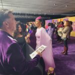 Fatima Robinson Instagram - So full of gratitude for all the people who put this movie together. Beautiful Night💜Masterpiece of a Movie….The Color Purple will blow you away. Hair @lenajaye_ Make up @bobbierileybeauty Earrings and cuffs @lisaeisnerjewelry Rings @_neoancient_ Hat @houseofmalakai Dress @alexperryofficial