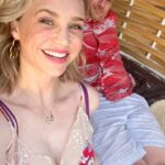 Fiona Gubelmann Instagram – It’s been such a joy to getaway with my partner in crime @thebestalexweed. It’s our first trip together in over 3 years. And we needed it. Parenting during the pandemic while alone in a foreign country has been hard. I’m so grateful for this amazing trip and time to connect. @fspuntamita is pure paradise. 
☀️💗🌴
I wanted to point out my Necklace. I’m sure you’ve seen it over the years. It is one of my staples from @sarahojewelry. It’s their Ascent Pendant: “Your dreams, goals and hard work have led you here. Bask in the joy of your accomplishment because you have earned it. Pause to honor and celebrate how far you have come.”
This message really resonated with me and I wear it as a reminder to celebrate and recognize my growth. As a perfectionist, it’s too easy to ignore any growth or success. So I love this necklace reminding myself to pause and feel gratitude and joy, rather than the perpetual cycle of comparing myself to the impossible goals of where I think I should or need to be. 
💗
👗 @zadigetvoltaire @riichyb 
Earrings are from @julievos 
Thanks to @agcare1989 for taking my curls in this crazy humidity
And I’m beyond obsessed with @supergoop 
•
•
•
•
#StrangerReels #fspuntamita #vacation #anniversary #paradise #fionagubelmann #beach #mexico #SunscreenButMakeitmakeup #sunscreen #sunset #sun