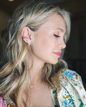 Fiona Gubelmann Instagram - Thank you @sarahojewelry for helping me to customize a very special pair of earrings 💖 
•
I had some earrings that were very sentimental but I never wore because they didn’t quite feel like “me”. So I worked with a designer at Sarah O to redesign the earrings. It was a very fun process. We went back and forth on lots of different designs and after seeing sketches and models in CAD, we finally created the perfect pair of earrings. 
I couldn’t love these any more!!! I wanted an asymmetrical earring with art deco / vintage inspirations and a nod to the flaming heart ❤️‍🔥 
•
I trusted Sarah O since I’ve shopped with the company before and knew they have amazing quality. And a bonus that it’s a female owned small business 🥰