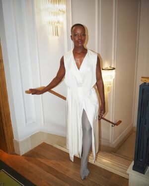 Florence Kasumba Instagram - #BlackPanther #WakandaForever London press tour. Styling @hollyevawhite @thewallgroup  Make up @rebekahmakeup  Dress & Boots @victoriabeckham Jewelry @cartier #florencekasumba