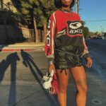 Freddie Ransome Instagram – My look for TEMPO last weekend🏁

Top: @thegoldlist.co 
Custom Skrrt: @thegoldlist.co 
Heels: @aliasmae 
Sunglasses: somewhere in Miami
Jewelry: @gossamerjewels 
Bag: @brandonblackwoodnyc 
Sneakers (for when my feet got tired of being hot girls): Jordan 4s (Oreo)
