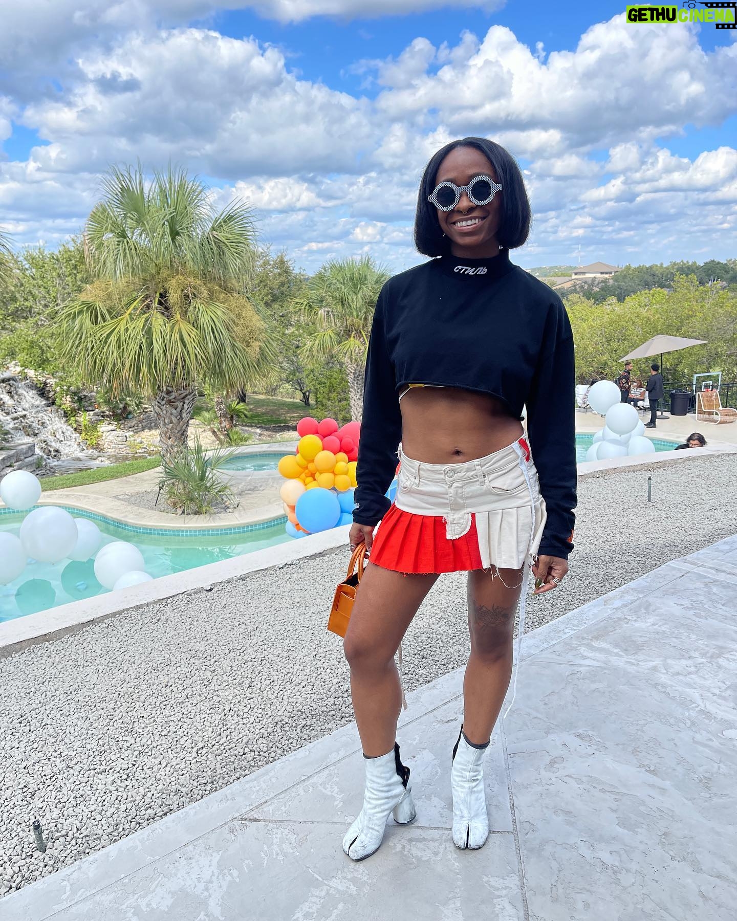Freddie Ransome Instagram - my favorite look from @afro.tech weekend! thanks @culturehouseofficial for having me spin some chunes! top: @heronpreston skirt: @ansarelithelabel boots: @maisonmargiela bag: @brandonblackwoodnyc sunnies: @akila.la X @chinatownmarket
