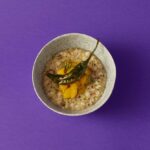 Garima Arora Instagram - 6 days to go! every bowl of breakfast back home in India is wholesome, nutritious and packed with flavours! So is breakfast @here_bkk. millets 𝓚𝓱𝓲𝓬𝓱𝓭𝓲 with pickle mango and grill chilies. Want to learn more about millets use in India? Visit www.foodforward.in or @foodforwardindia and listen to the interview with the Millet Sisters Foundation in Telangana. Link below in comments.