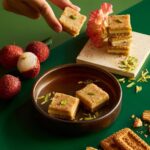 Garima Arora Instagram - This lychee & Parle G mithai! 🤯🤯🤯 One of the best part of working on @marigold.delights is the fun we’ve had in the kitchen coming up with naughty combinations for mithais. My favorite is this ode to India’s most popular biscuit… where mithai meets cheesecake. Parle g crumble on the bottom… barfi in the middle.. gooey lychee on the top!! 😋