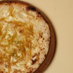 Garima Arora Instagram - Like 𝘕𝘢𝘢𝘯 other: Candied Ginger, Sour Cream and Lime zest. A playful ode to the glorious Naan bread.... our naans are topped with fun n naughty toppings. Smash this one with a bottle of Domaine de Montbourgeau, Macvin du Jura. @here_bkk is now open for dinner 5.30 pm onwards. See you HERE