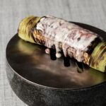 Garima Arora Instagram - The “CORN RIB” is now live @restaurant_gaa .we never thought we would retire the crowd favorite young corn from our menu but I dare say I prefer the upgrade. Purple corn brined like a piece of rib and finished on the grill doused in pomegranate molasses! Eat it like a rib!