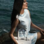 Geethika Tiwary Instagram – Geethika (@geethikaofficial) graces the rugged seaside, effortlessly merging timeless elegance with a contemporary edge. With her serene glow and undeniable confidence, she captivates the lens, creating a striking visual narrative. Tune in as we craft this coastal masterpiece, blending fashion, art, and nature in perfect harmony.
——————————————————————
On @geethikaofficial: 
Look 1
Wool-blend fedora hat, Headscarf, Short wool crepe dress with satin details, Thigh-high flat boots, all by @dolcegabbana

Look 2
Checkerboard-print beaded crop top, Check pattern mini-skirt, Medusa ‘95 tote bag, all by @versace. Earrings by @ellieador

Look 3
Silk-blend Bandeau cropped top, Medusa ‘95 mini skirt in wool, Medusa over-the-knee boots, all by @versace

Look 4
Fringed open-knit top and Fringed scalloped mini-skirt, both by @tomford, Ring and earrings, both by @ellieador
——————————————————————
Talent: Geethika (@geethikaofficial)
Photographer: Abdulla Elmaz (@abdullaelmaz)
Stylist: Hussy ElCeliemy (@elceliemy)
Creative Director: Talal Kahl (@talalkahl)
Makeup artist: Jefferson Rivera (@jhajhamakeupartist)
——————————————————————
#Geethika #Fashion #Actor #PartnerFeature