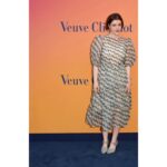 Georgie Henley Instagram - a very happy grape! completely joyous to celebrate female entrepreneurship and creativity with @veuveclicquot at their stunning exhibition Solaire Culture, bringing some much needed sunshine to London until the 6th June 🍇☀️🥂