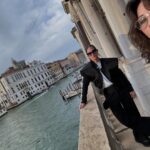 Gina Gershon Instagram - 25 years ago my sistah @amandademme and I stood on this same balcony. Everything and nothing has changed. #venice #biennale #friendship