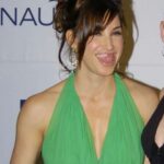 Gina Gershon Instagram - Happy St Patricks day to all you Leprechauns out there 🍀🍀🍀 (I do believe This is the Greenest dress I’ve ever worn )and thanks to @we_are_the_gemini for always finding these random photos !!#happystpatricksday💚💚💚