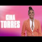 Gina Torres Instagram - GUESS what’s happening tomorrow!!!! It’s me! it’s @iamjhud It’s the @jenniferhudsonshow It’s going to be a GOOD TIME! Don’t miss this! Tune in February 15th on @foxtv and catch all the 🫖 😘 💄: @tobyfleischman 💇🏽‍♀️: @1nicnac Pants: @victoriabeckham Top: @karen_millen