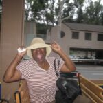 Gina Yashere Instagram - It's been a sad couple of weeks for me. Those of you who've read my book will know my friends James 'Rocky' Williams & his wife Bernice. I met Rocky as a young fledgling elevator engineer, when he was flown over from NYC to London to help us build the elevators at the Canary Wharf Tower. Seeing the racist & sexist abuse I was suffering as the first woman engineer, he took me under his wing. I met his wife Bernice, a few months after we met, when I visited NYC. She welcomed me into her home, and wouldn't let me near a McDonald's for the next few weeks, as she cooked hearty Caribbean food, & wouldn't allow me in her kitchen, which was fine by me 🤣 They pretty much adopted me into their lives, with their son Rawle, and for the last 30 years, they have been my American family. I had no idea that when I sent a limo to their house to pick them up & bring them to my show in NYC last summer, as that was the only way I could force them to sit thru an hour of me swearing, that that would be the last time I'd be able to spoil them both. I received a call 2 weeks ago that Bernice had fallen ill. I spoke to her on the phone briefly & grabbed a flight from LA. By the time I got there, she was non verbal, but was aware of her surroundings. Her hospital room was full of family, friends & everybody who loved her. And I was glad I was able to hold her hand & kiss her goodbye before she passed 2 days after I arrived. I flew back to NYC this week for her ceremony. And tho it was sad, she received the most beautiful send off from her church and her entire community. I'm glad Rocky & Rawle are surrounded by their loving extended family. These are pics from when they visited me in LA, back in 2011 in my little one bed in Hollywood. We had a blast, & I was looking forward to hosting them again, this time at my house, where they wouldn't have to sleep on a rickety sofabed from Craigslist, but it wasn't meant to be. Bernice was kind, sweet, & had these big, expressive eyes, & I will miss her lilting Trinidadian accent & her laugh. Rest well Bernice. Love you. 💔