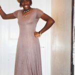 Gina Yashere Instagram - 1995. Outfit for my 1st ever stand up show. I LOVED that dress. Had them in several colours. Wore them TO DEATH. Always with some kind of cap to the back. Feminine, but only just 🤣 And I was all about the cowry shells, silver & Egyptian musk. Man, If I'd known how cute I was I woulda been a BITCH! 🤣 And that flat stomach IS NOT AIRBRUSHED 🤣 GO BUY MY BOOK! #cackhanded. Audio (yes by me) or print #throwbackthursday #tbt #babygina