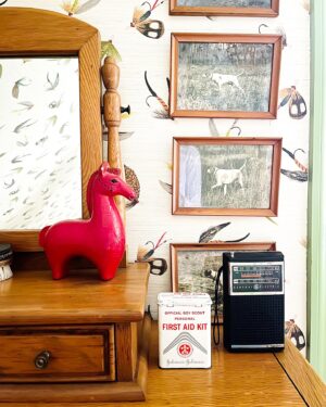Gray Benko Instagram - If you’ve been watching our show on @magnolianetwork , you may have seen the episode where we went back to my dad’s childhood home to collect the bedroom furniture, art, and all of the many knick-knacks that he grew up with.  Charlie has this cute little room of of his bedroom that I have dubbed his “sleepover room”. Although none of his friends will ever sleep in it because they think it’s too scary (one of the stipulations that come with living in a 200  year old house). The room was really meant to be an ode to my dad and the time period when he grew up, complete with the old relics on full display, that I found stuffed in his bedroom drawers.  He’s probably going to be mad that I just called his things relics. Anywho, if you watch the episode, then you will also know that I gave the room a fishing theme as a way to poke a little fun at him because one time I found an old fishing scrapbook that he made, where he cut out magazine and newspaper images of fathers fishing with their sons.  My dad has always been a terrible fisherman and he told me that he made that scrapbook one day because he had always longed for his dad to teach home how to fish, but he never would.  So I proceeded to give this entire room a fishing theme, from the fishing lure wallpaper by @abnormalsanonymous, to the fishing net-reminiscent light by @straydogdesigns.  I even had @benkoman hand carve and paint a fish for me to mount the light fixture on.  Well, the day of filming rolls around and Grumpy decides to wait until the cameras are rolling to tell me that the entire story was made up. It was a school project and he’s always hated fishing.  So, I guess the joke was on me.  As usual.  At least I got a cute room out of it. The lesson here?  Grumpy is not to be trusted. 
Bedding by @annieselke