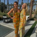 Heather McDonald Instagram - Slide Right. I Had a 1970 themed Palm Springs party last night. I got this dress b/c I knew it would pair perfectly with my sister’s. Shannon is wearing our mom’s dress from the early 1970s. How cute is my daughter in @trinaturk More pics and videos to come. No filter or photo shop on these FYI @goldstein.shannon @kraftmackncheese @deniseaustin @thebrandyhoward #palmsprings #laquinta #party #cocktails #pool #palmtrees #memorialday #1970s #eveningdress #juicyscoop #heathermcdonald @shophelsi is my dress