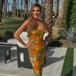 Heather McDonald Instagram - Slide Right. I Had a 1970 themed Palm Springs party last night. I got this dress b/c I knew it would pair perfectly with my sister’s. Shannon is wearing our mom’s dress from the early 1970s. How cute is my daughter in @trinaturk More pics and videos to come. No filter or photo shop on these FYI @goldstein.shannon @kraftmackncheese @deniseaustin @thebrandyhoward #palmsprings #laquinta #party #cocktails #pool #palmtrees #memorialday #1970s #eveningdress #juicyscoop #heathermcdonald @shophelsi is my dress